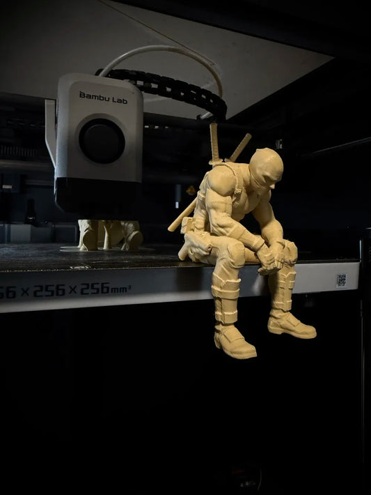 Sad Deadpool sitting on a ledge Figurine!